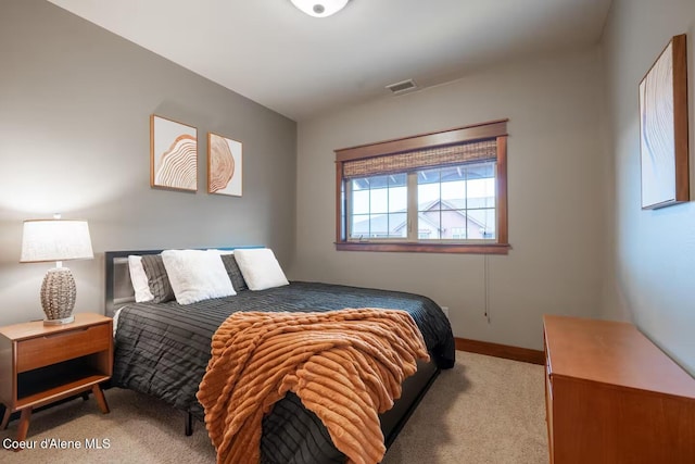 bedroom featuring light colored carpet