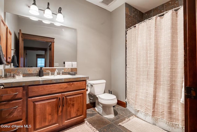 bathroom with a shower with curtain, vanity, and toilet