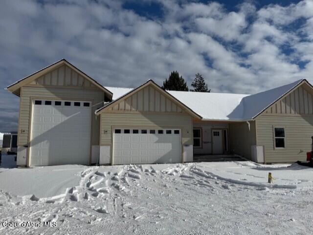 view of front of house with board and batten siding and an attached garage