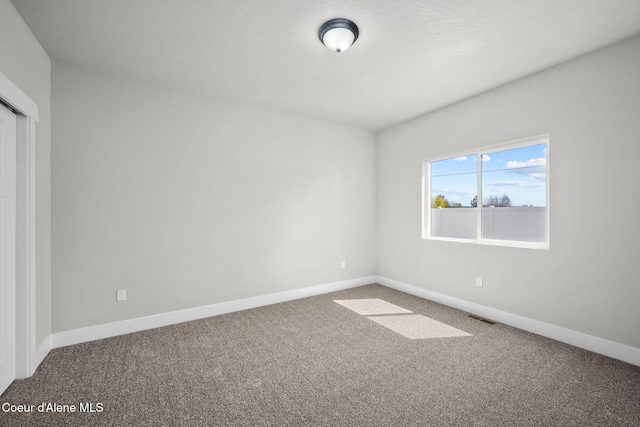 1225 W Orchard Ave, Hayden, ID 83835 - carpeted empty room featuring baseboards and visible vents