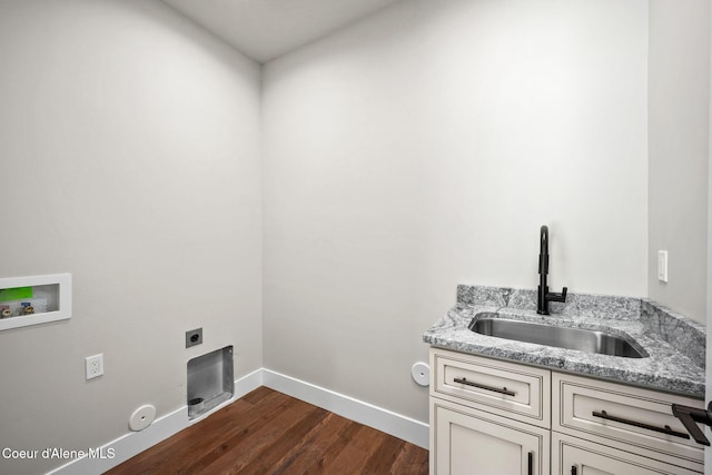 1225 W Orchard Ave, Hayden, ID 83835 - clothes washing area featuring dark wood finished floors, hookup for an electric dryer, a sink, hookup for a gas dryer, and hookup for a washing machine