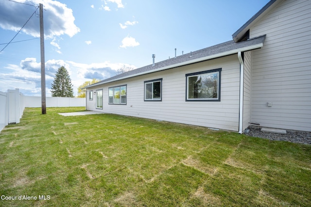 1225 W Orchard Ave, Hayden, ID 83835 - rear view of property with fence, a patio area, and a yard
