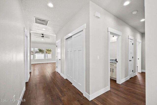 1225 W Orchard Ave, Hayden, ID 83835 - corridor with recessed lighting, dark wood finished floors, visible vents, and baseboards