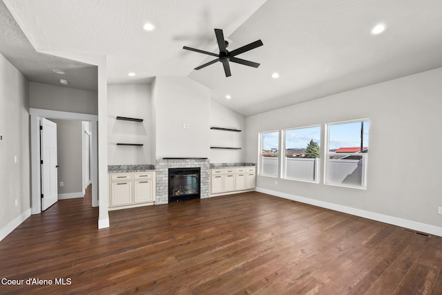 1225 W Orchard Ave, Hayden, ID 83835 - unfurnished living room with a fireplace, dark wood-style flooring, baseboards, and ceiling fan