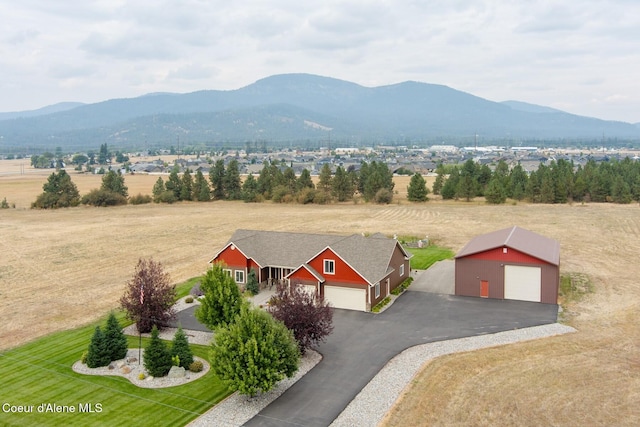 birds eye view of property with a rural view and a mountain view