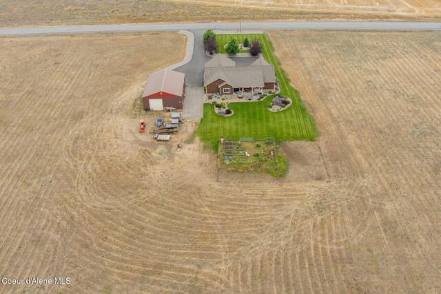 birds eye view of property featuring a rural view