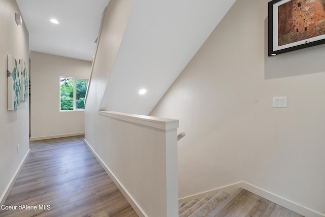 hall with hardwood / wood-style floors