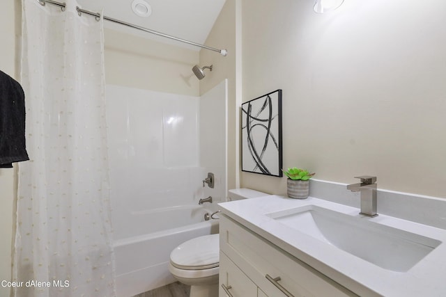 full bathroom with vanity, shower / tub combo with curtain, and toilet