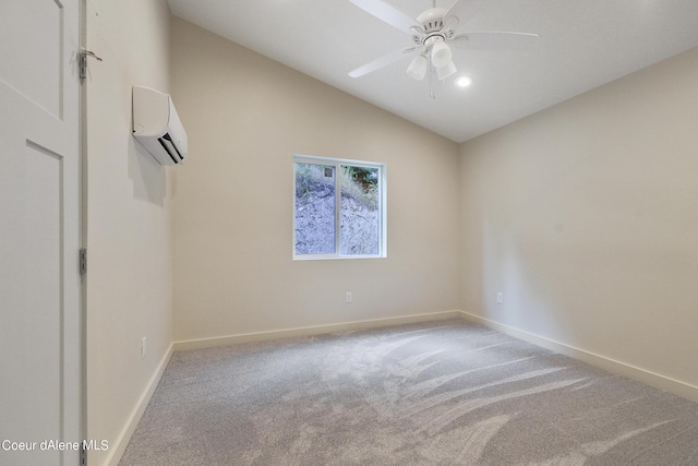 unfurnished room with lofted ceiling, a wall mounted air conditioner, light colored carpet, and ceiling fan