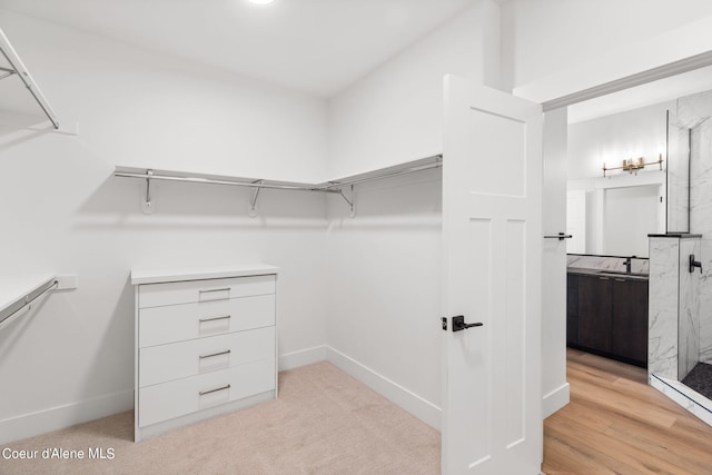 walk in closet featuring sink