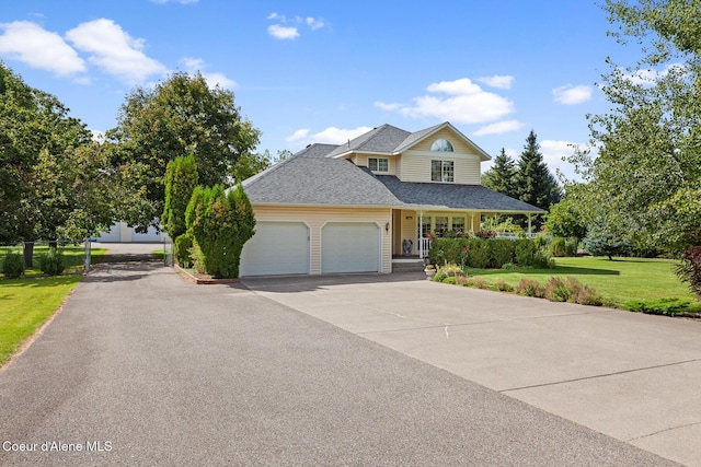 view of front of house featuring a garage and a front yard