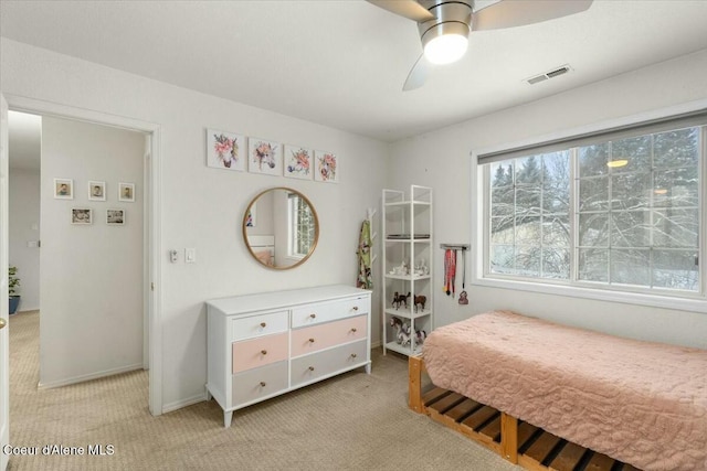 bedroom featuring light carpet and ceiling fan