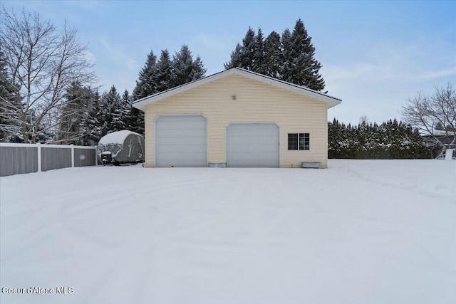 view of snow covered garage