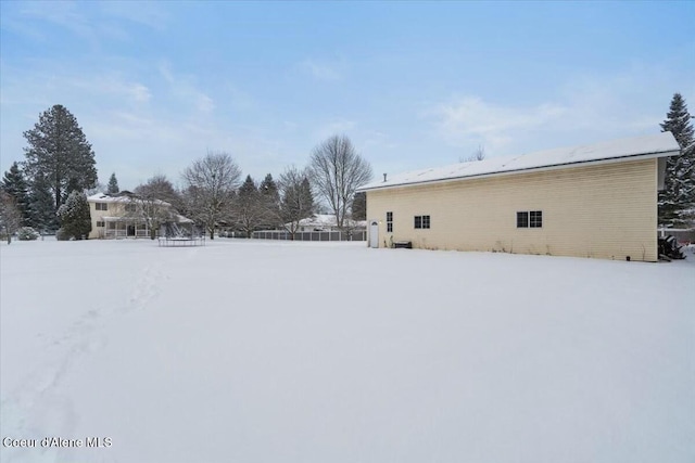 view of yard layered in snow