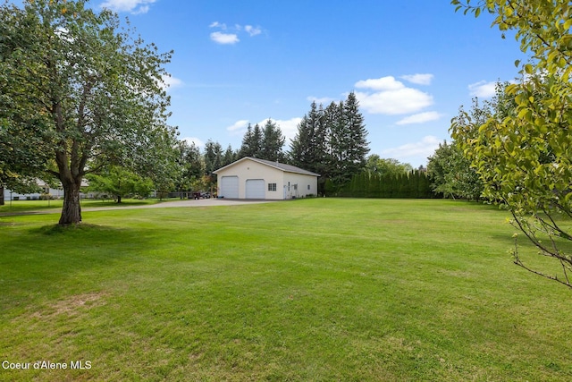 view of yard with a garage