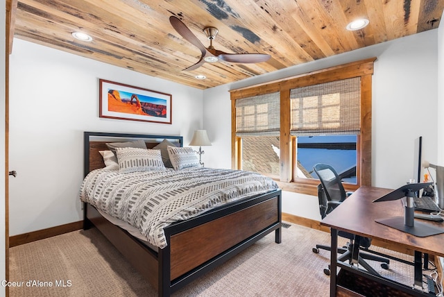 carpeted bedroom with wood ceiling