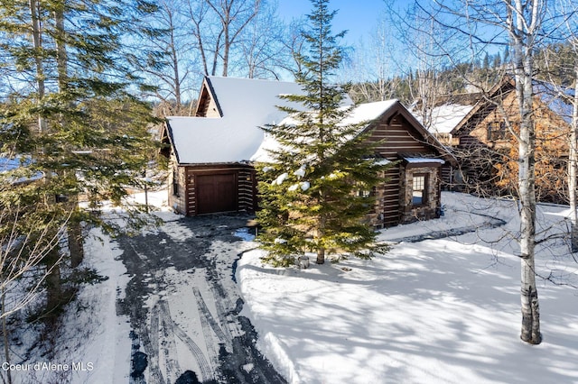 log cabin with a garage