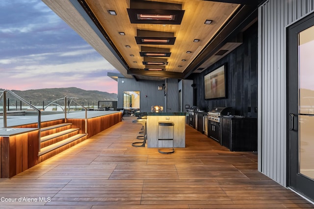 exterior space with a mountain view and a grill