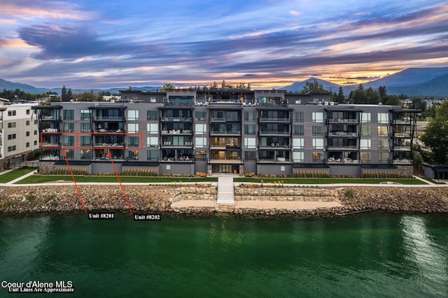 exterior space featuring a water and mountain view