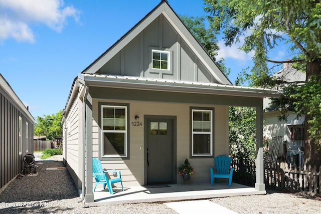1224 Chestnut St, Sandpoint, ID 83864 - view of front of property featuring board and batten siding, a porch, and metal roof