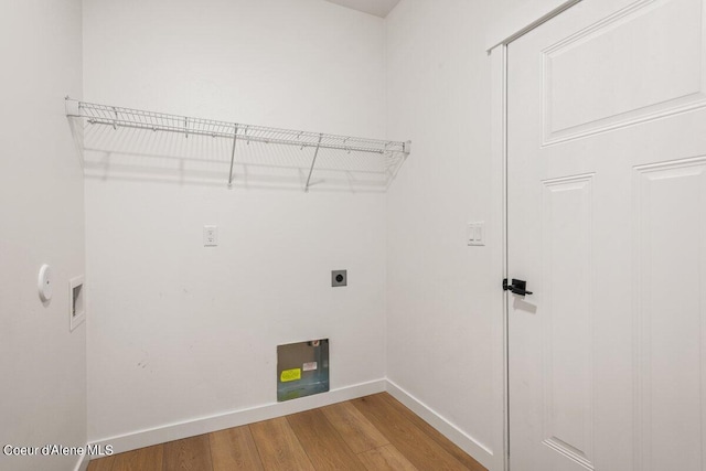 laundry room featuring hardwood / wood-style flooring, electric dryer hookup, and hookup for a washing machine