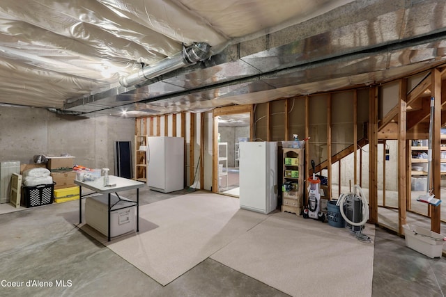 basement with white fridge
