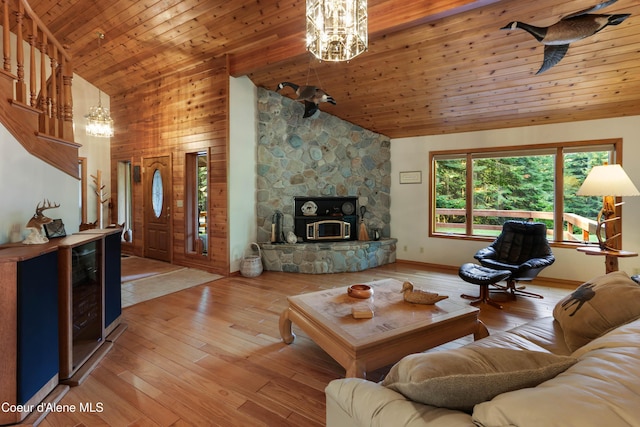living room featuring high vaulted ceiling, wine cooler, a notable chandelier, wooden ceiling, and light wood-type flooring
