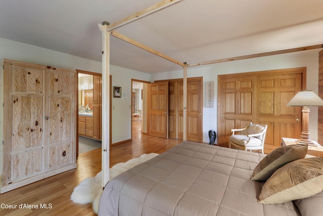 bedroom with hardwood / wood-style flooring