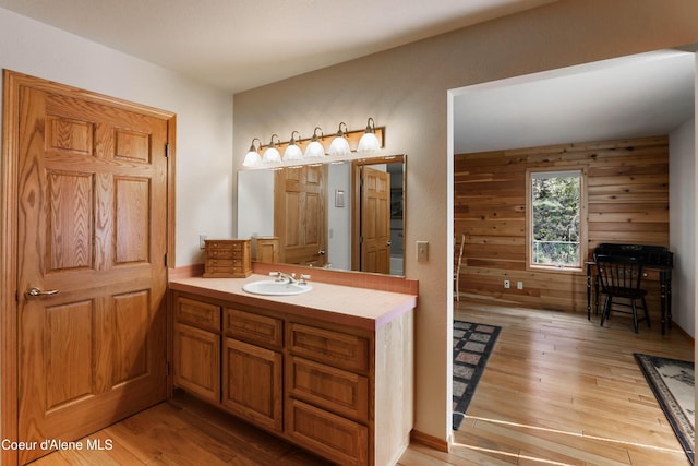 bathroom featuring hardwood / wood-style flooring and vanity