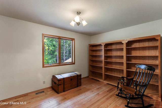 sitting room with light hardwood / wood-style floors
