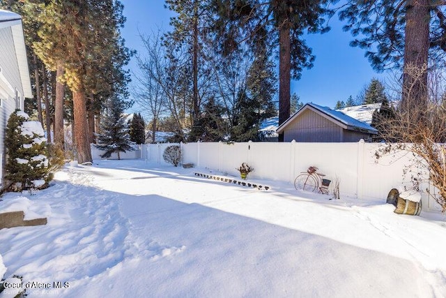 view of yard covered in snow