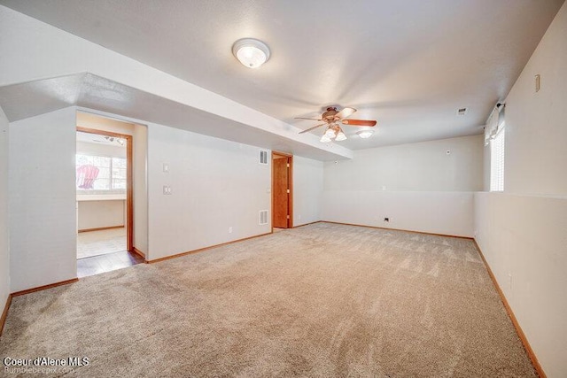 carpeted empty room with ceiling fan