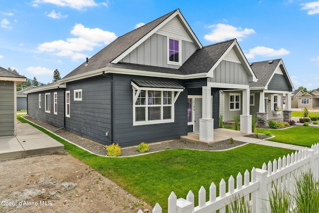 7148 N Bellac Ln, Coeur Dalene, ID 83815 - view of front of house with board and batten siding and a shingled roof