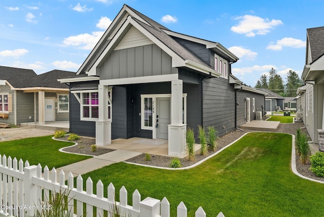 7148 N Bellac Ln, Coeur Dalene, ID 83815 - view of front of house featuring board and batten siding and central AC unit