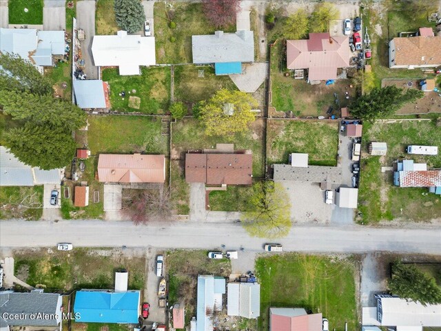 birds eye view of property with a residential view