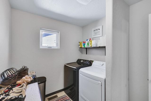 laundry room featuring separate washer and dryer