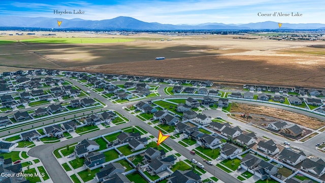 birds eye view of property with a mountain view