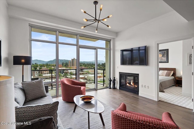 living room featuring hardwood / wood-style flooring and a chandelier