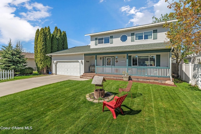 view of front facade with a garage, covered porch, and a front lawn