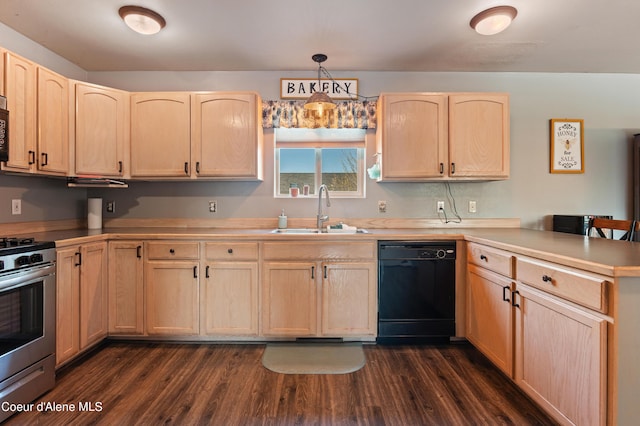 kitchen featuring light brown cabinetry, sink, black appliances, and hanging light fixtures
