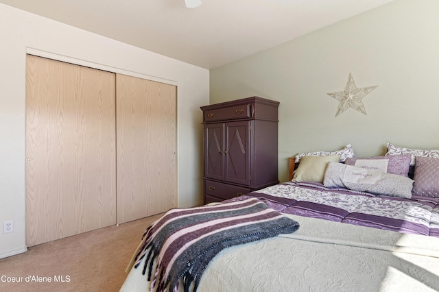 carpeted bedroom with a closet