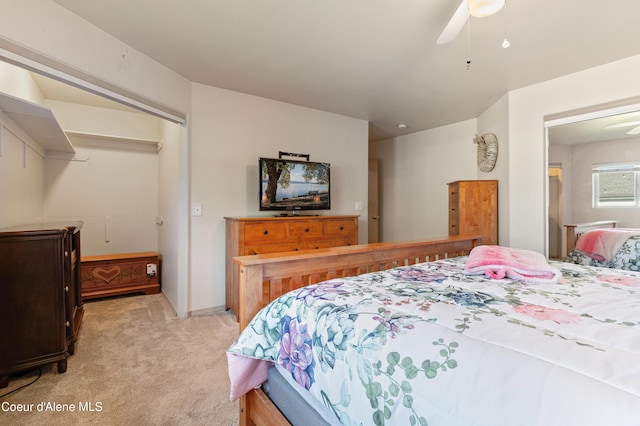 bedroom with light carpet and ceiling fan