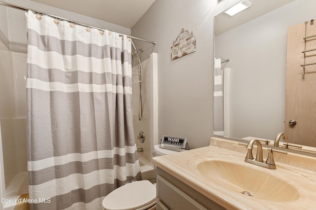 full bathroom featuring vanity, shower / bath combination with curtain, and toilet