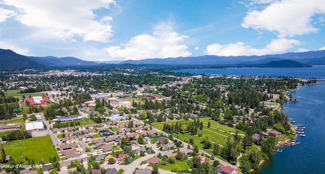 bird's eye view with a water and mountain view