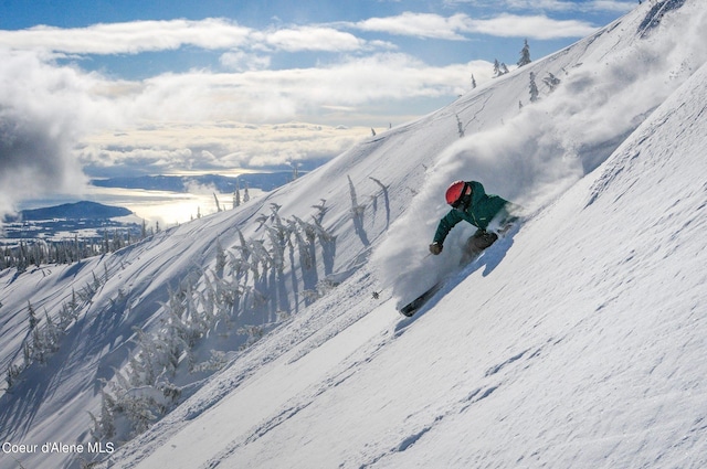 snowy aerial view featuring a mountain view