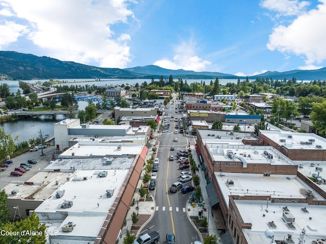 drone / aerial view with a water and mountain view