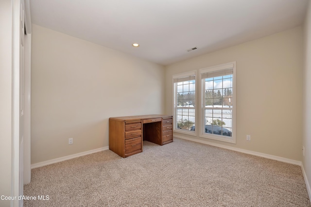 unfurnished bedroom with light colored carpet