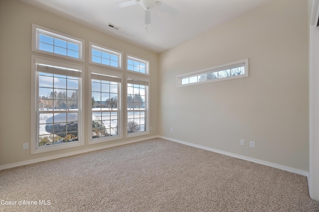 carpeted empty room with ceiling fan