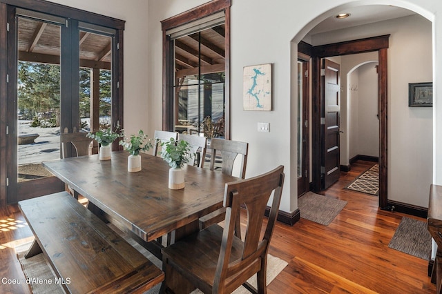 dining space with dark hardwood / wood-style floors