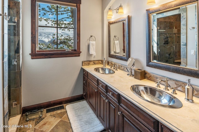 bathroom with vanity and a shower with shower door